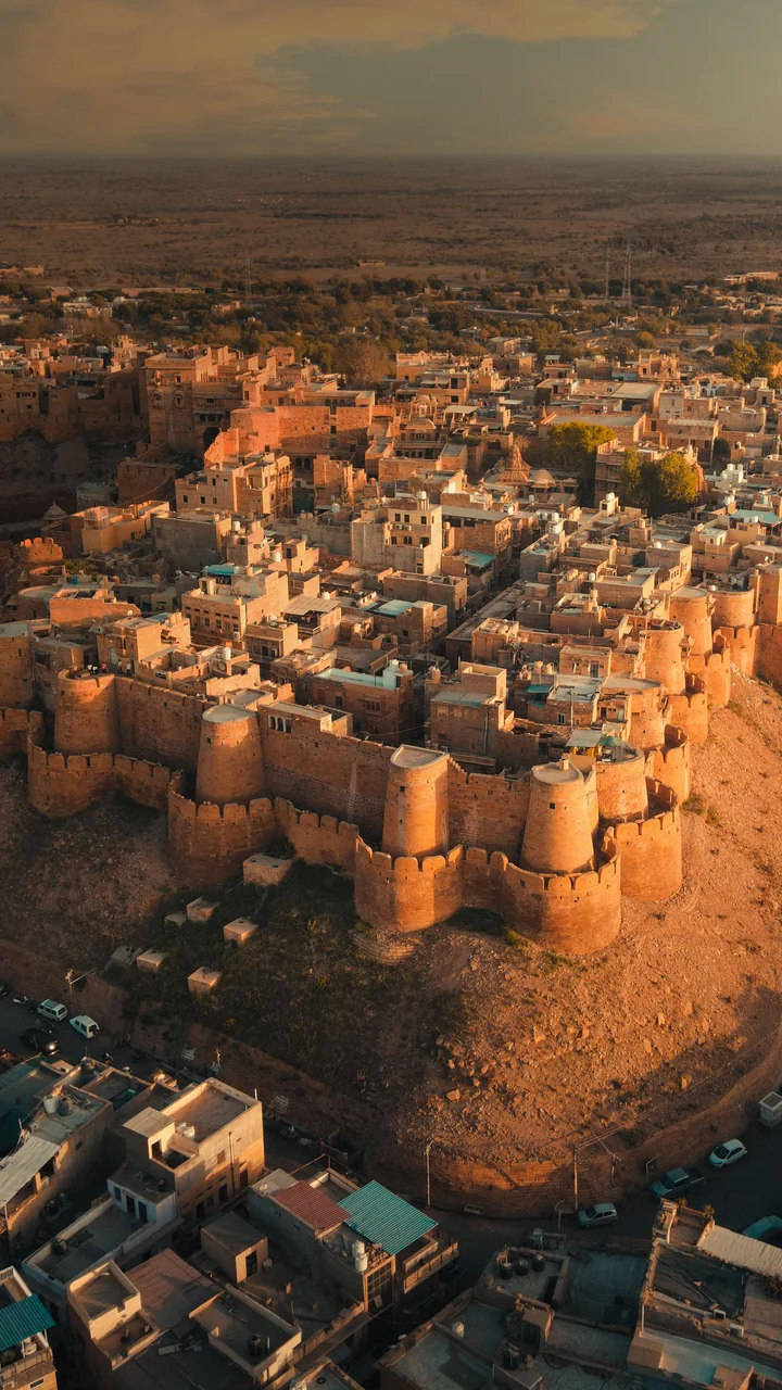 The golden ramparts of Jaisalmer Fort rising from the Thar Desert